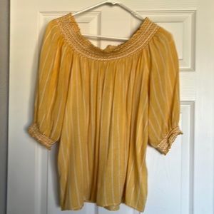 Gold top with white stripes.